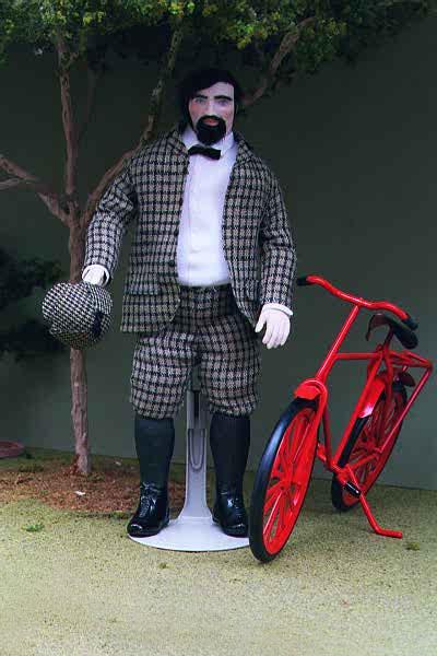 This Miniature Doll is called Vincent.  He stands next to his red bicycle.