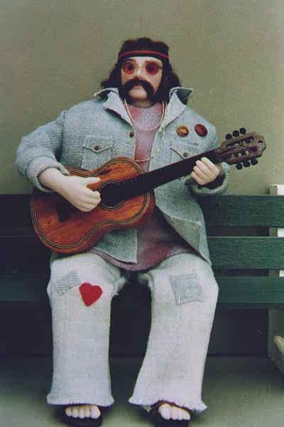 This Miniature Doll's name is Paul.  He is dressed like a hippie.